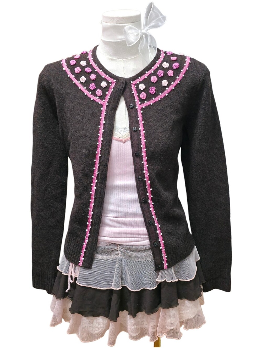 Paraphrase lambs wool dark brown cardigan with pink details, beading and rosette